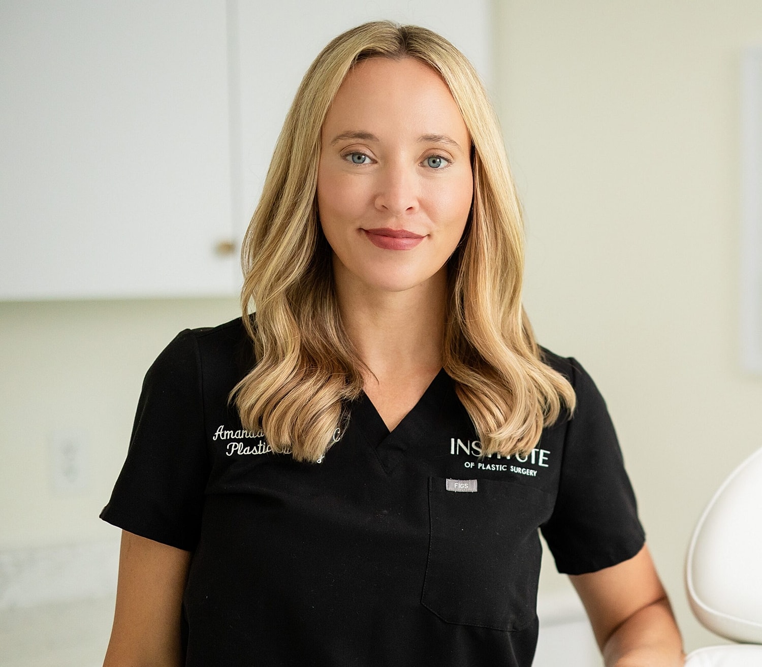Female plastic surgeon in professional attire.