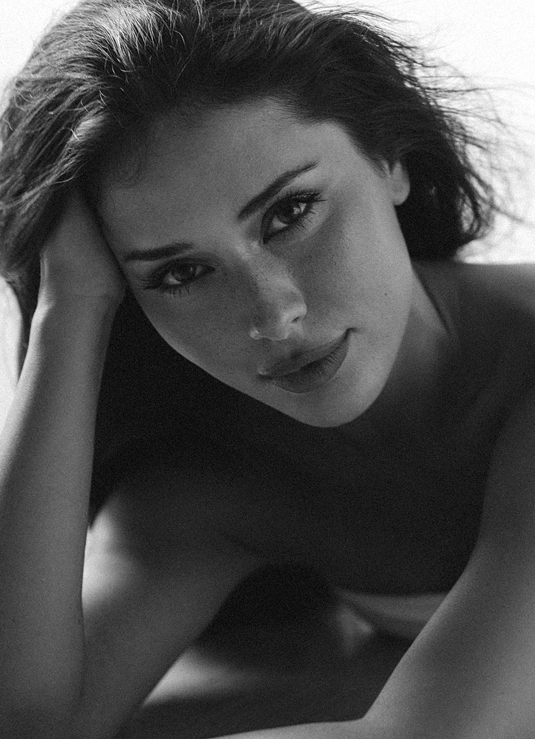 Portrait of a woman with thoughtful expression.