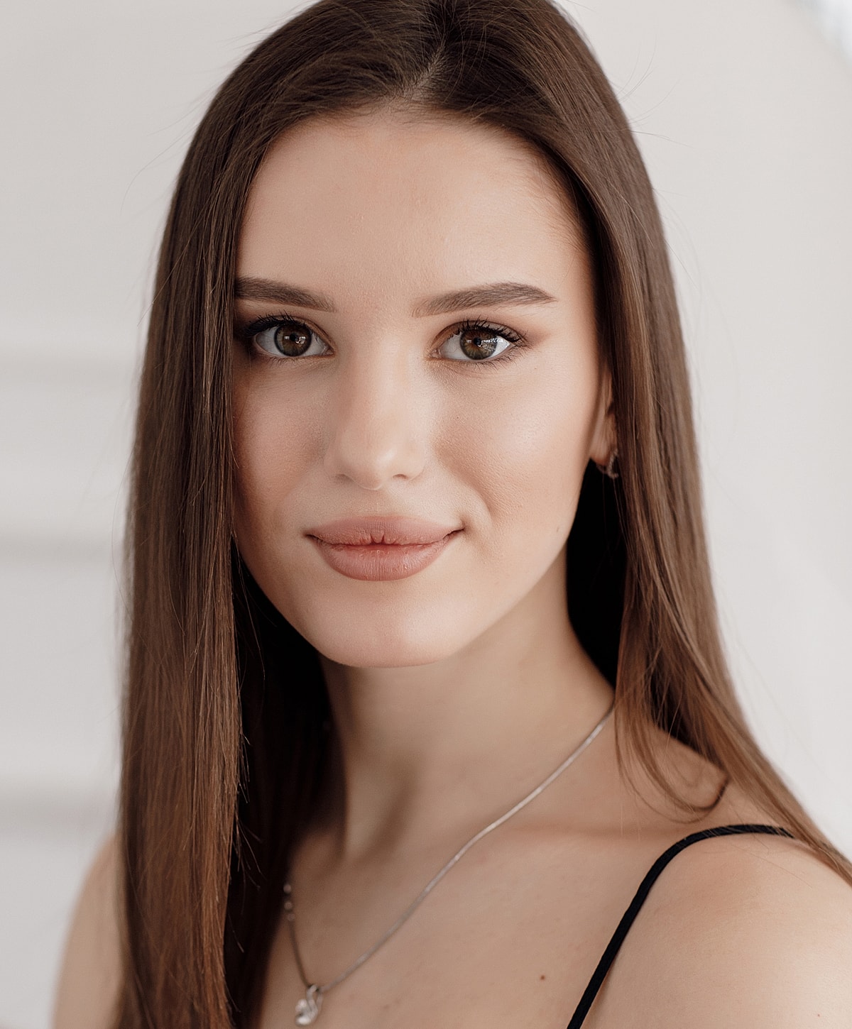 Portrait of a young woman with long hair.