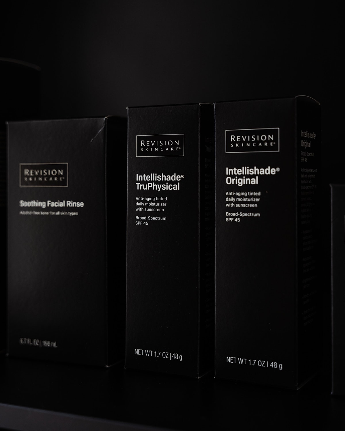 Revision Skincare product packaging on shelf.