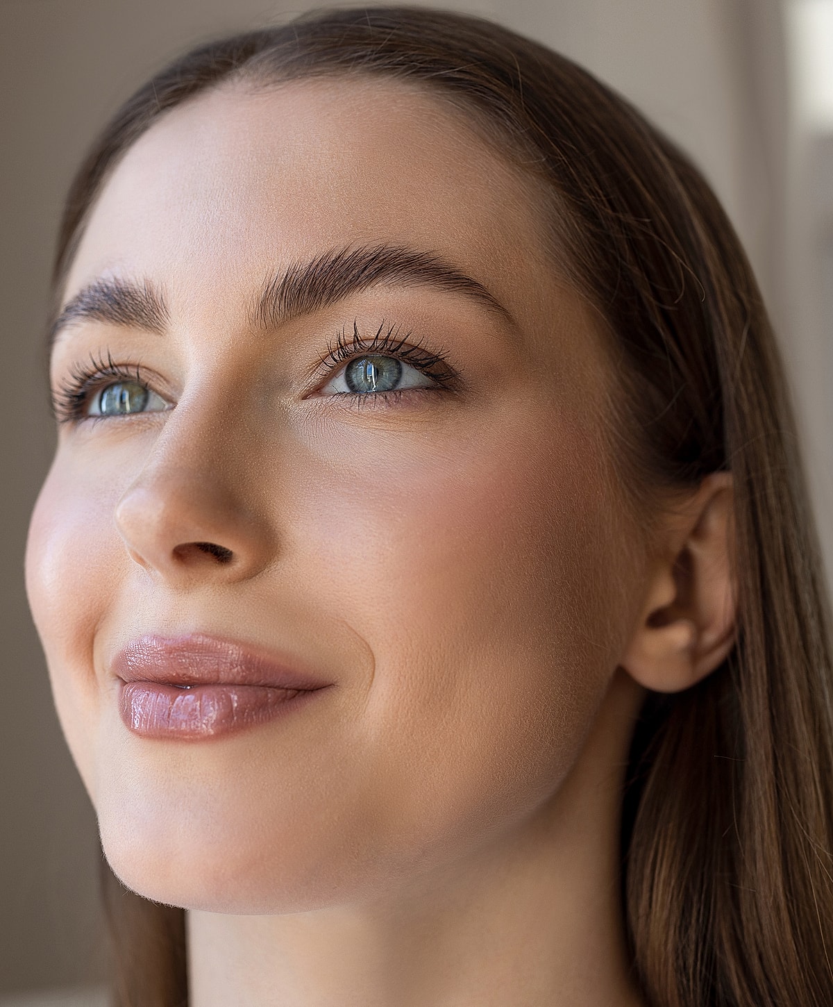 Close-up of a smiling woman with beautiful features.