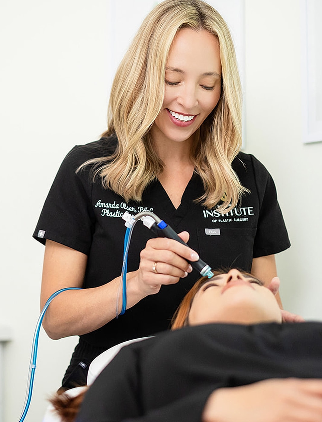 Medical professional performing a skincare treatment.