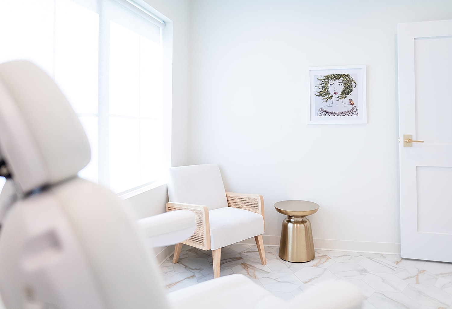 Bright, modern waiting area with art piece.