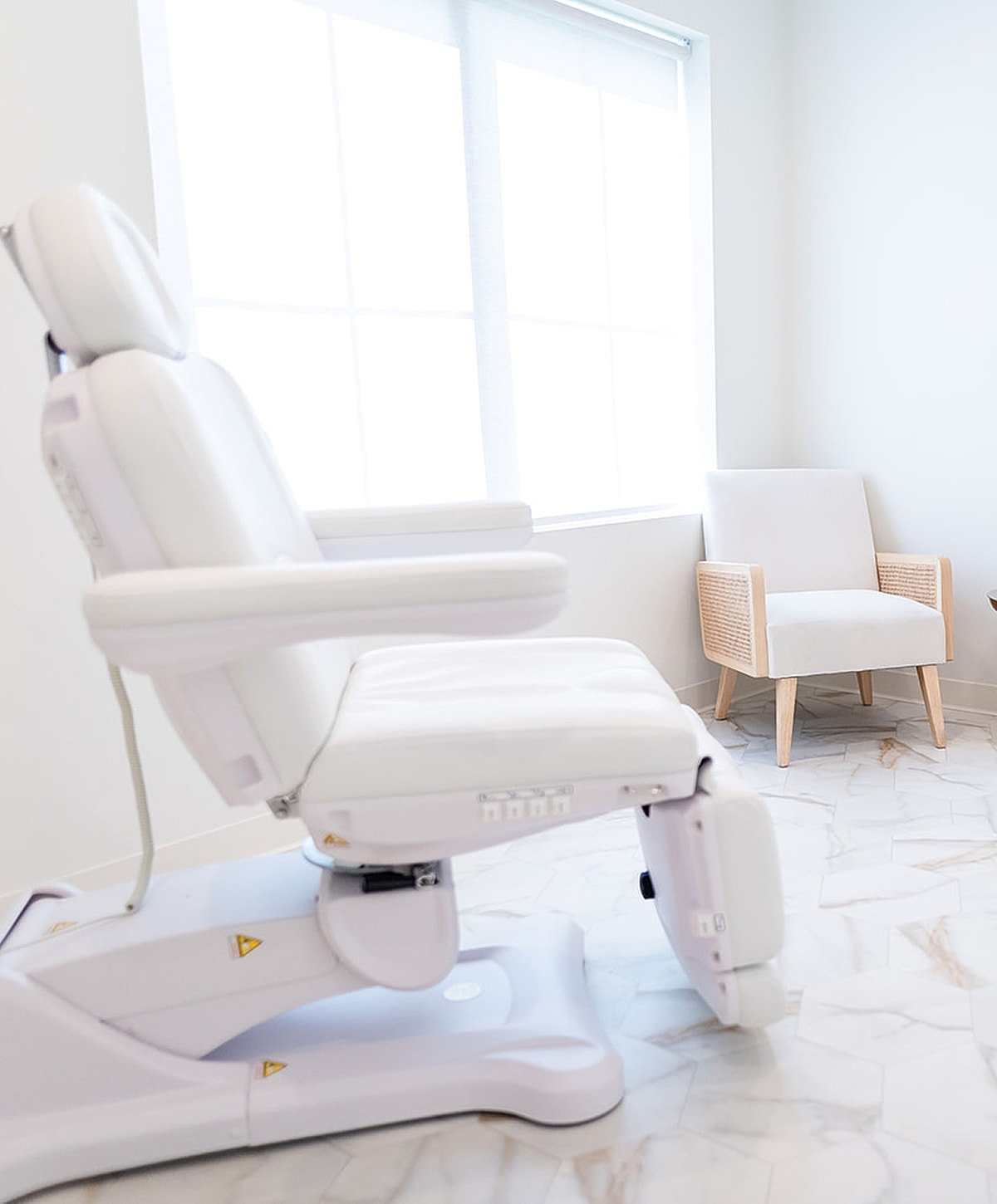 Modern dental treatment room with adjustable chair.