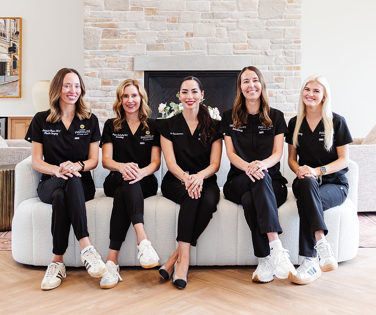 Five healthcare professionals in black scrubs.
