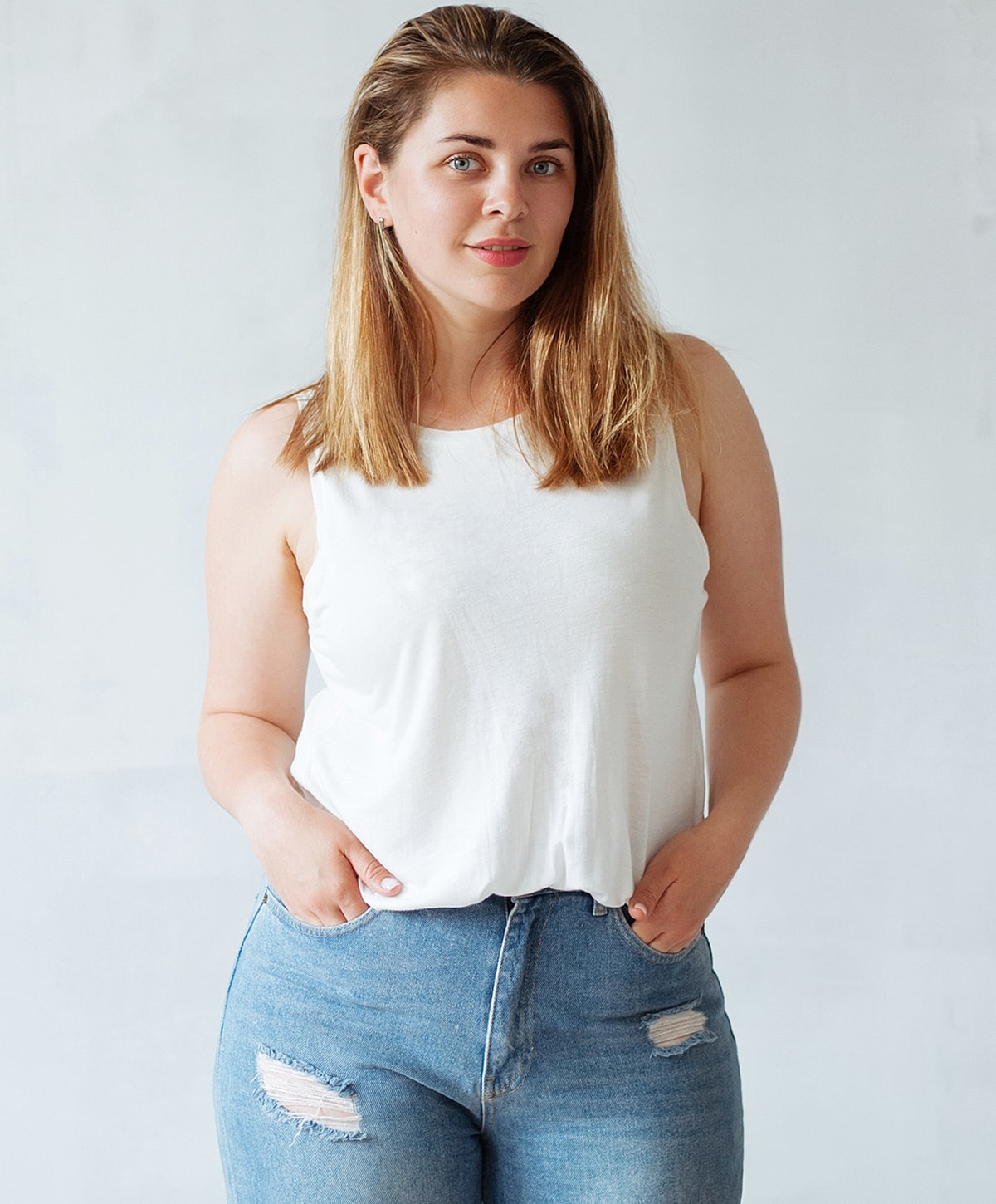 Woman in casual outfit against a light background.