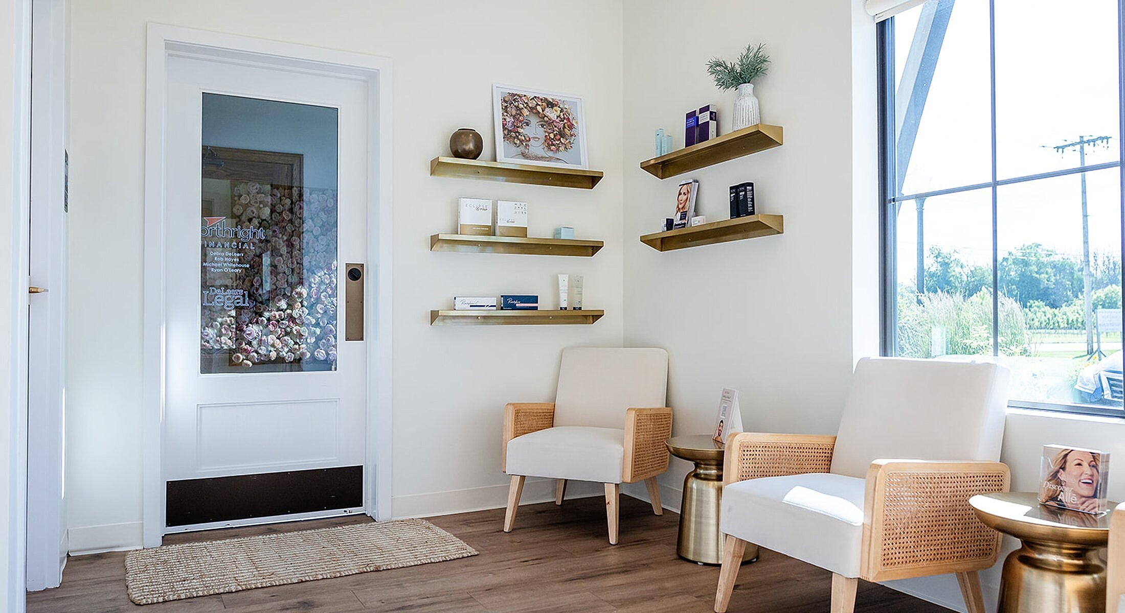 Cozy waiting area with light decor and shelves.