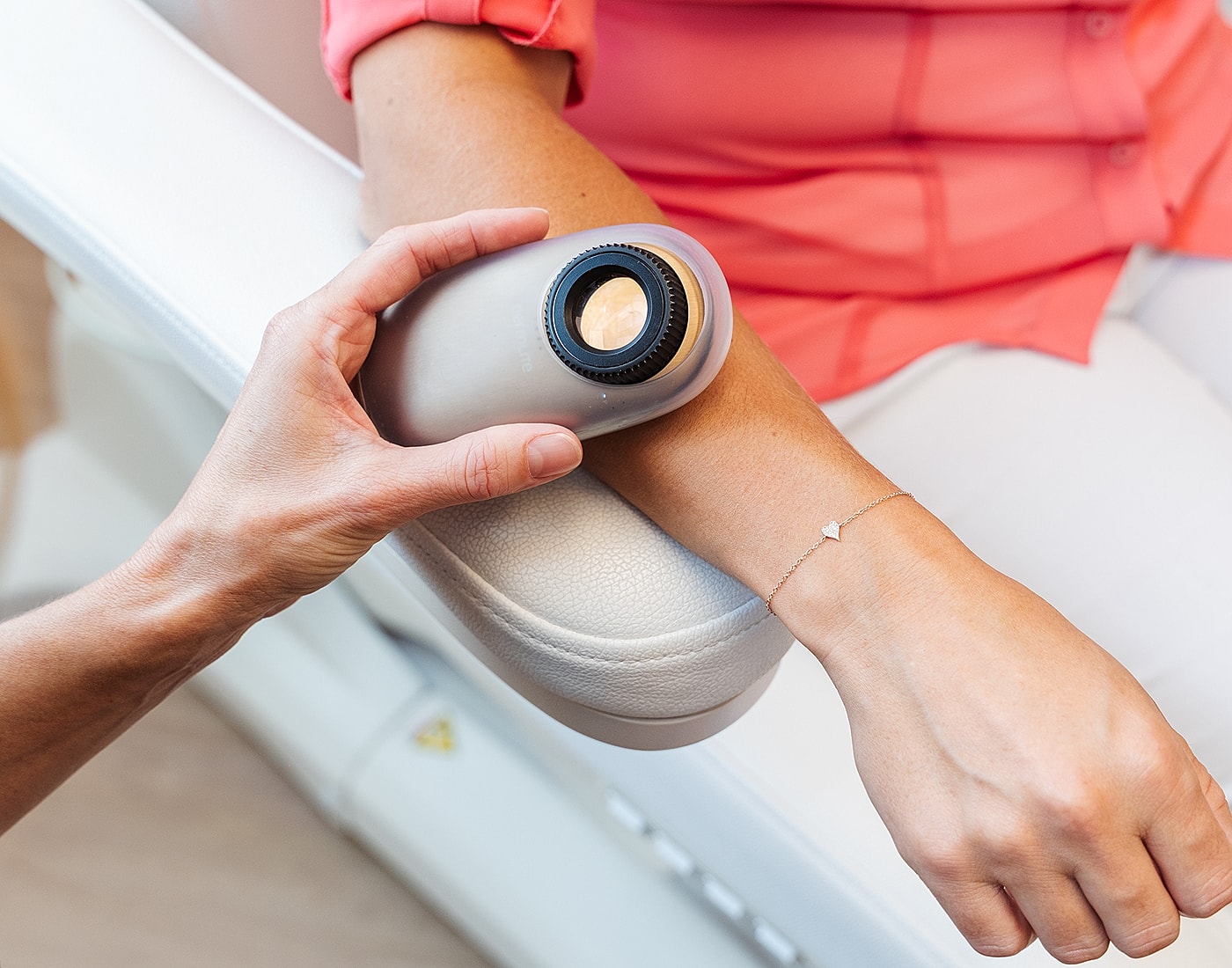 Skin analysis device on patient's arm.